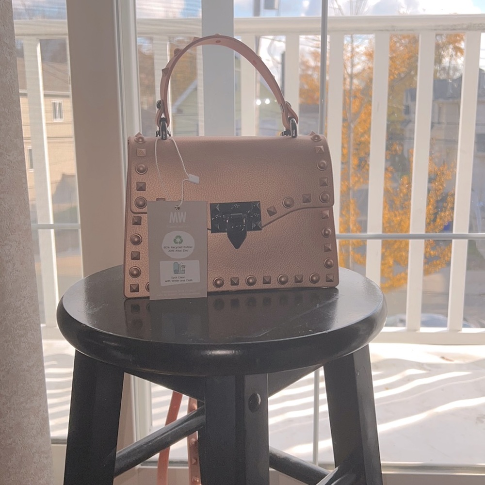 Brand new crossbody bag. It is small and a cute little pink bag.